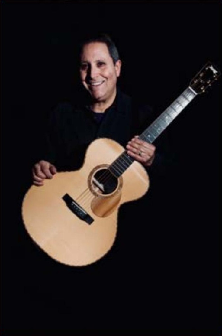 Anthony Amalfitano holding an acoustic guitar — songwriter and recording artist from Johnston, Rhode Island.